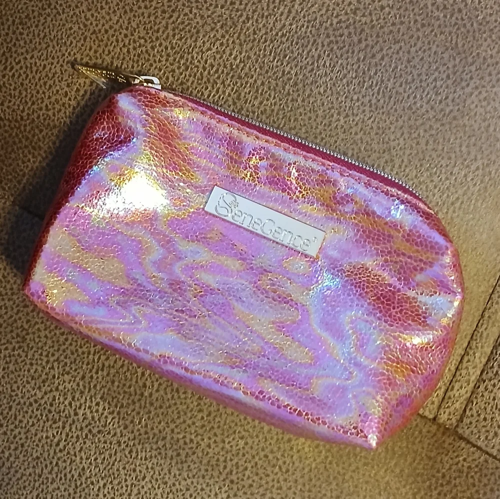 SeneGence pink holographic makeup bag with skin care and gloss samples